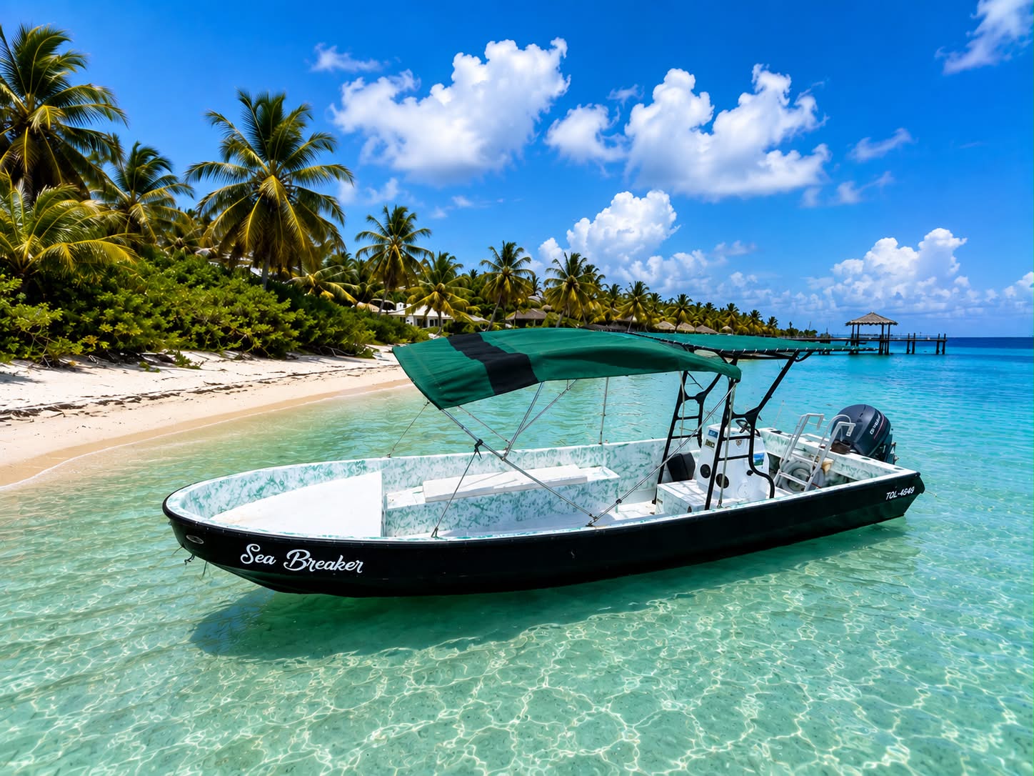 Sea Breaker tour boat anchored in crystal-clear Belize water